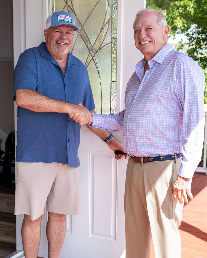 George Williamson meeting a voter at the door